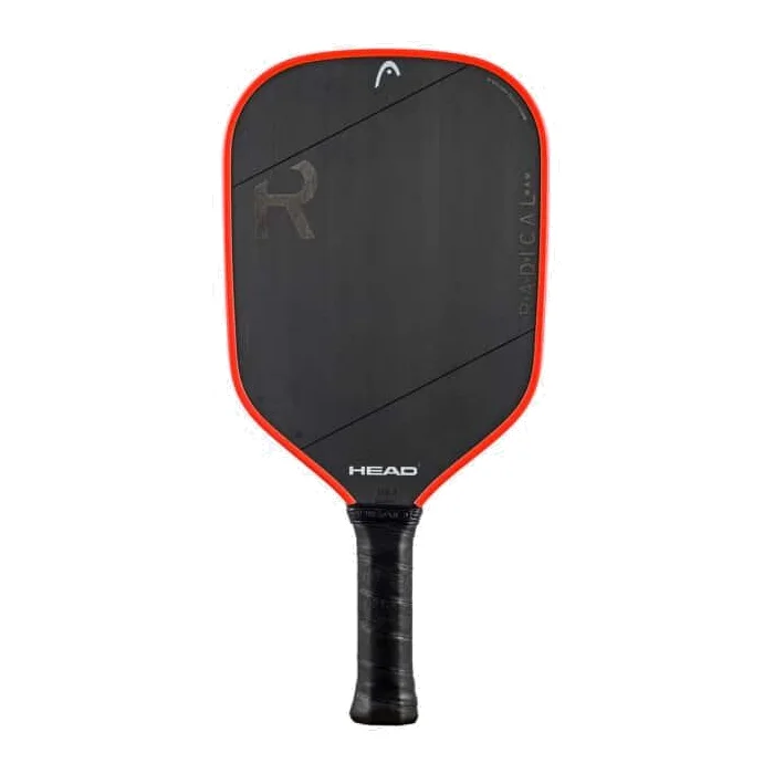 De HEAD Radical Tour Raw 2024 pickleball paddle met een donkerblauw en oranje design, liggend op een pickleballveld.